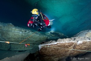 Photo-5 Brian Kakuk has his hands free to retrieve a jump in Tank Cave with off camera strobes on his back and one placed in the background