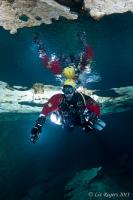 Reflections of Underwater Photographers in Tank Cave